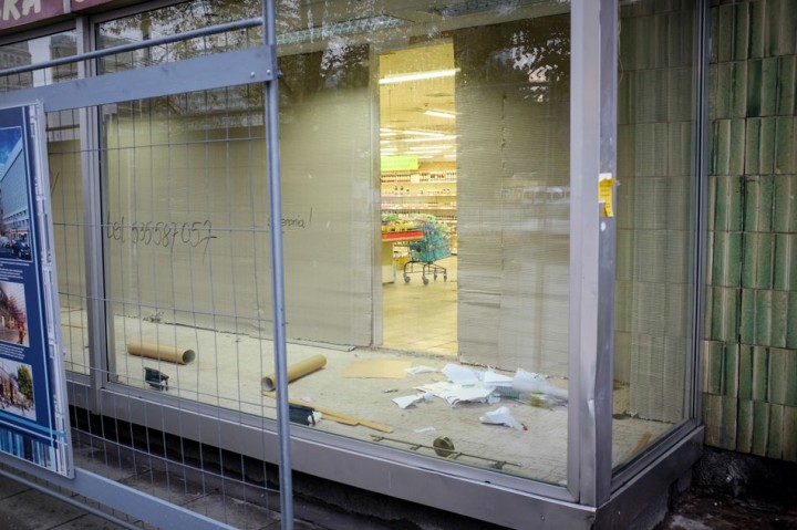 Empty shop displays and the lonely trolley inside.