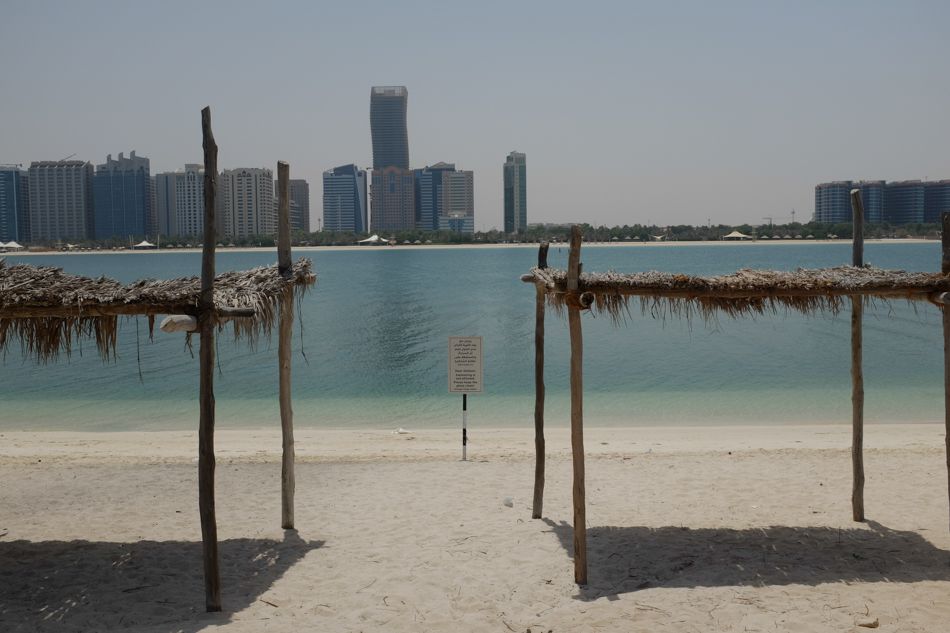 view at the city on the opposite side of the gulf. The view at the Abu Dhabi and Corniche beach 